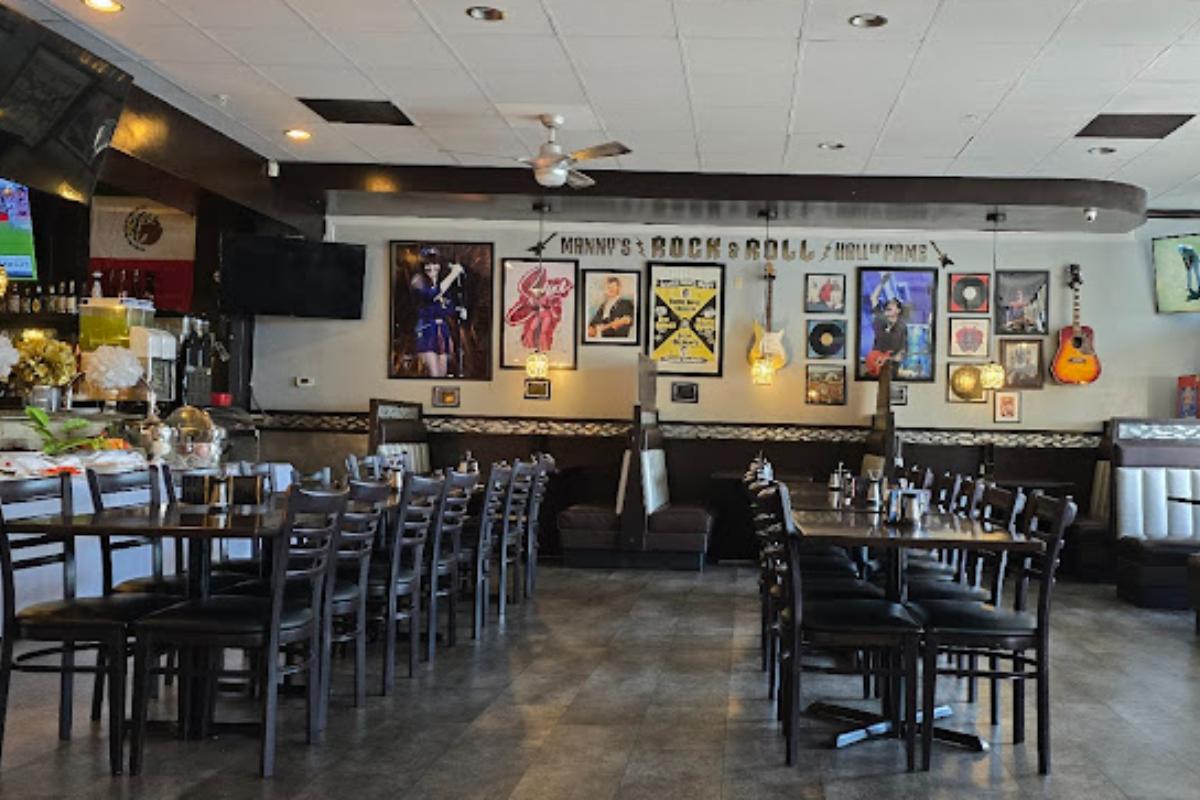 Interior of Azteca Mexican Grill featuring music-themed wall decor and booth seating.