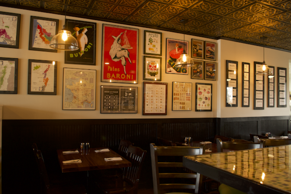 Interior of the Toni's Trattoria Italian Resturant showing wooden tables, chairs, and a clean service counter in Galena, Ohio.