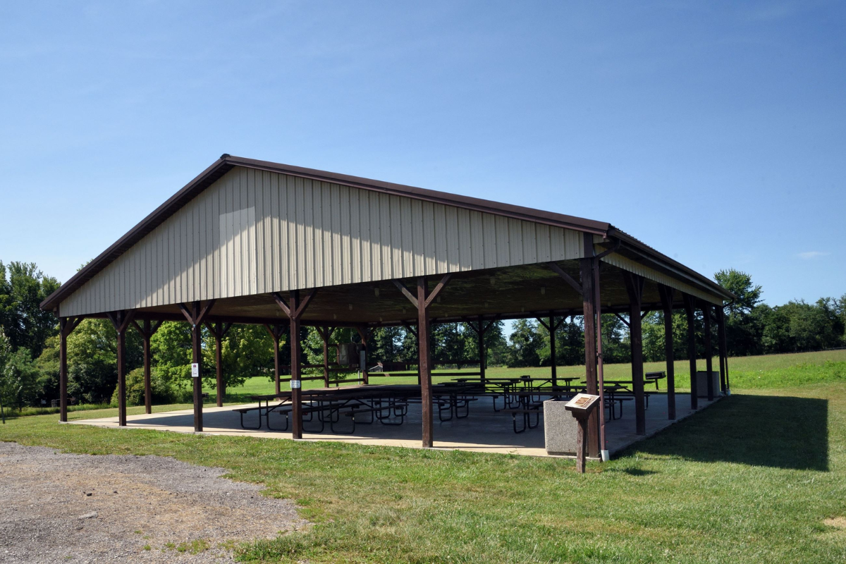 Large open-air picnic pavilion at Freedom Park in Sunbury, Ohio, surrounded by green fields.