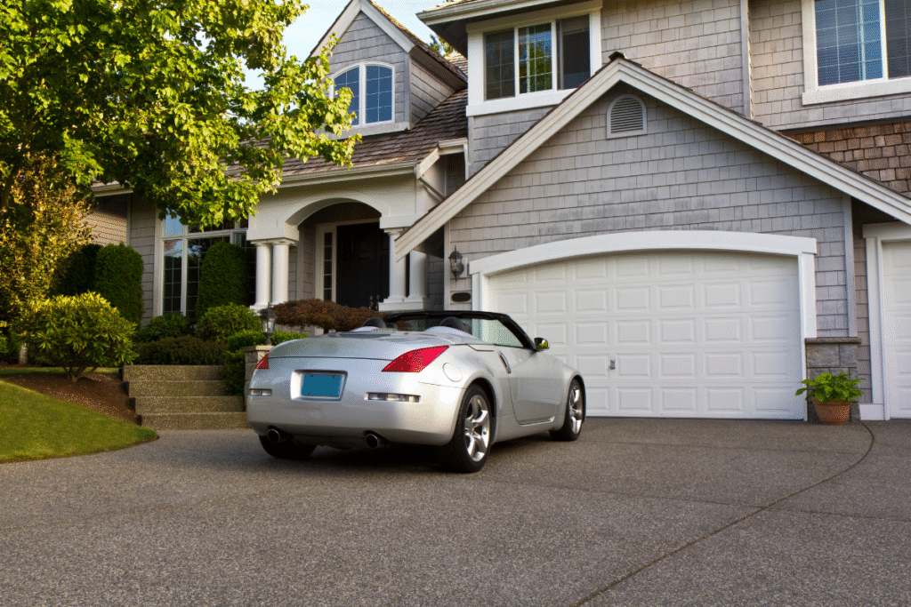 Silver convertible parked in the driveway of a suburban Lewis Center home.